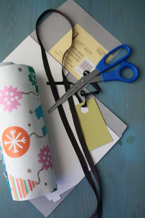 Gather Supplies Like Unused Scraps of Wrapping Paper, Scissors, Ribbon and a Plain Box